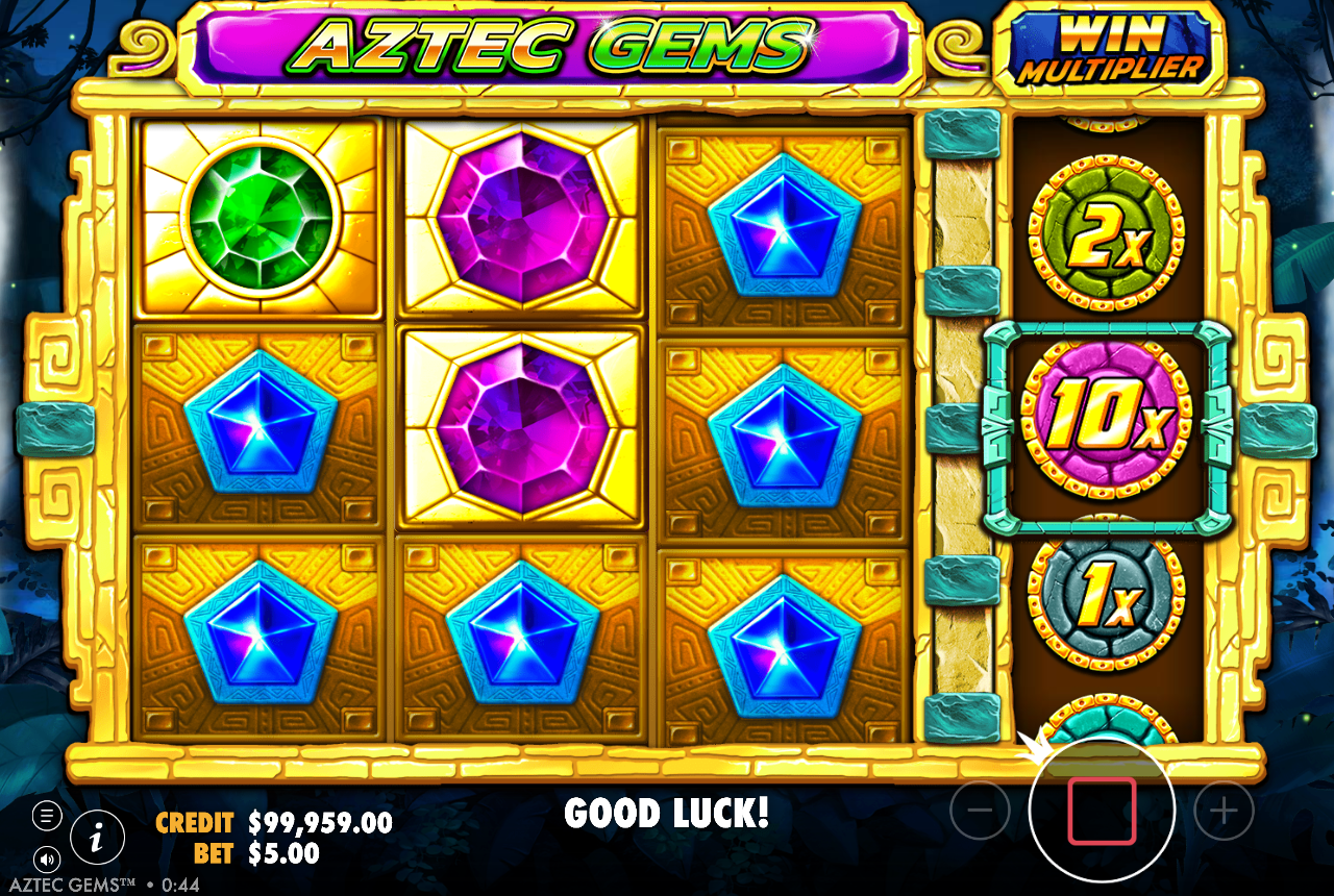 Aztec Gems mid-round with a full 3x3 board of blue pentagons, purple octagons and a green emerald, the Win Multiplier reel on the right showing a large 10x in the active window with 2x above and 1x below, the CREDIT A$99,959.00 and BET A$5.00 bar and a GOOD LUCK prompt