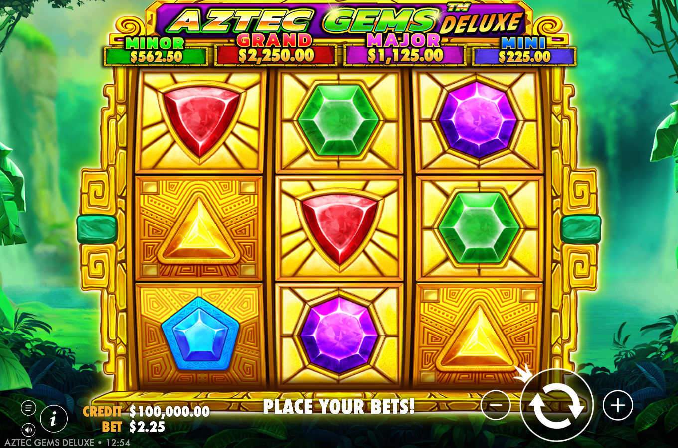 Aztec Gems Deluxe base game showing the 3x3 grid of Mesoamerican gems, red shield, green hexagon, purple octagon, blue pentagon and gold triangle, inside a golden Aztec temple frame, with the four-tier jackpot ladder MINI A$225, MINOR A$562.50, MAJOR A$1,125 and GRAND A$2,250 across the top, the golden Aztec sun-mask wild at right, and the CREDIT A$100,000.00 and BET A$2.25 bar