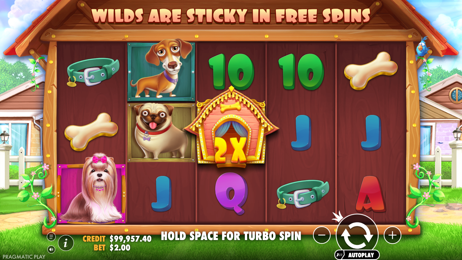 The Dog House base game 5x3 grid in daytime backyard with kennel wild carrying 2X multiplier badge on the centre reel and dog symbols including Maltes